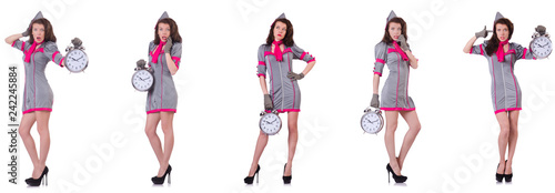 Young stewardess with alarm-clock in time management concept 