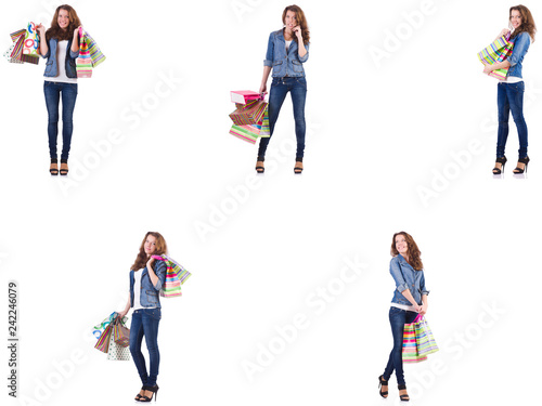 Young woman with shopping bags isolated on white © Elnur