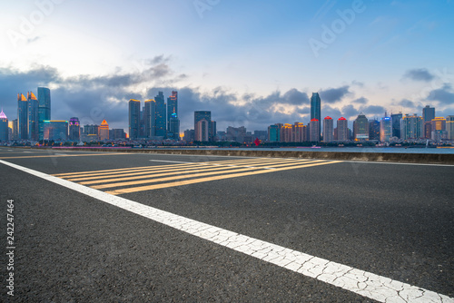 Empty asphalt road along modern commercial buildings in China,s cities