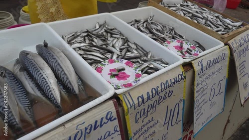 4K Soft-salted fish for sale with price tags, you can taste from saucer photo