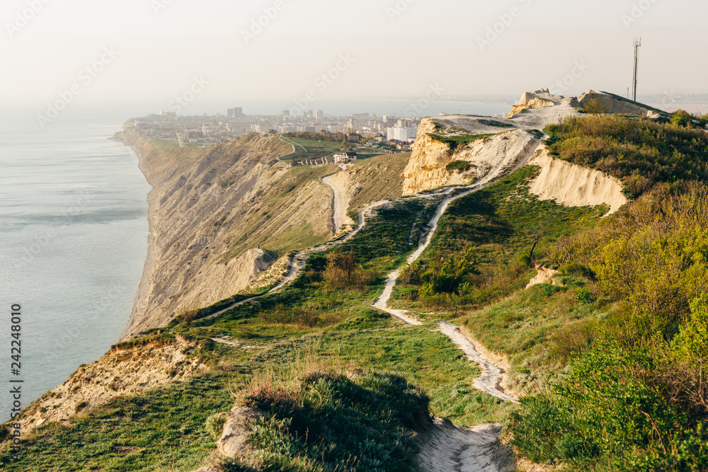 Mountain trail with scenic view of sea coastline and popular resort city. Anapa, Russia