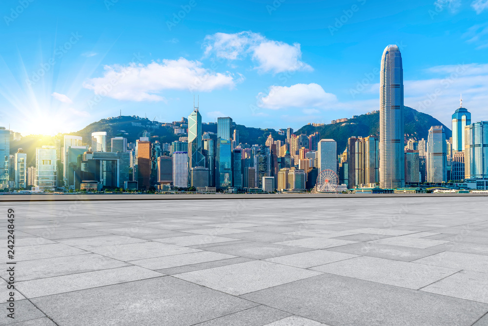 Empty marble floors and city views under the blue sky