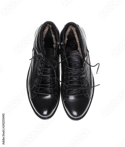 black men's shoes on a black isolated background
