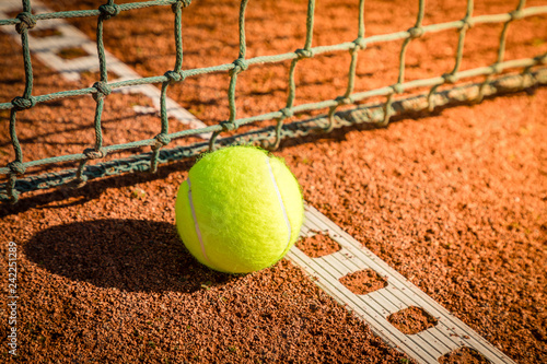tennis ball with line on a sand court © Nicole Lienemann