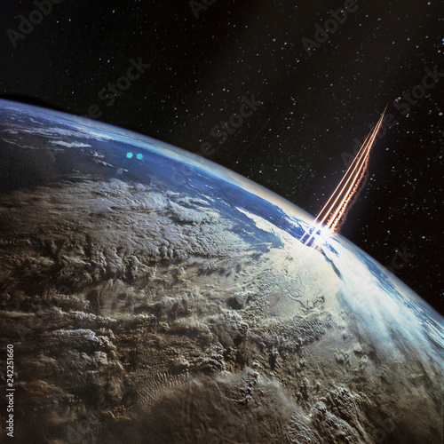 Fototapeta Naklejka Na Ścianę i Meble -  Missile launch, satellite view with planet Earth and galaxy stars. The elements of this image furnished by NASA.