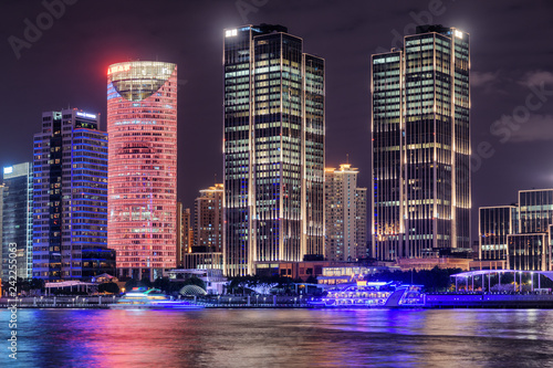Night view of modern waterfront buildings in Shanghai, China