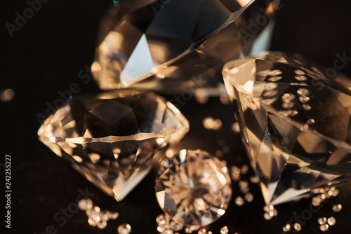 close up of pure golden diamonds isolated on black