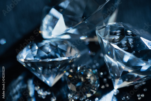 close up of transparent pure diamonds on black background photo