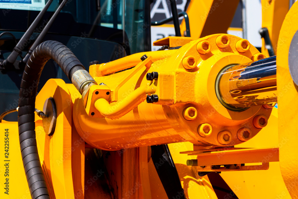 Hydraulic piston system for bulldozers, tractors, excavators, chrome plated cylinder shaft of yellow machine, construction heavy industry detail Hydraulic piston system for bulldozers, tractors, excavators, chrome plated cylinder shaft of yellow machine, construction heavy industry detail