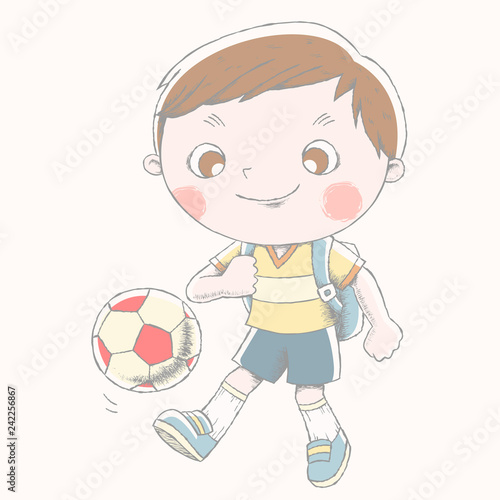 Cute boy playing soccer