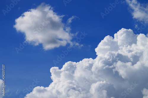 White Fluffy Cumulus Clouds Floating on Vivid Blue Tropical Sky
