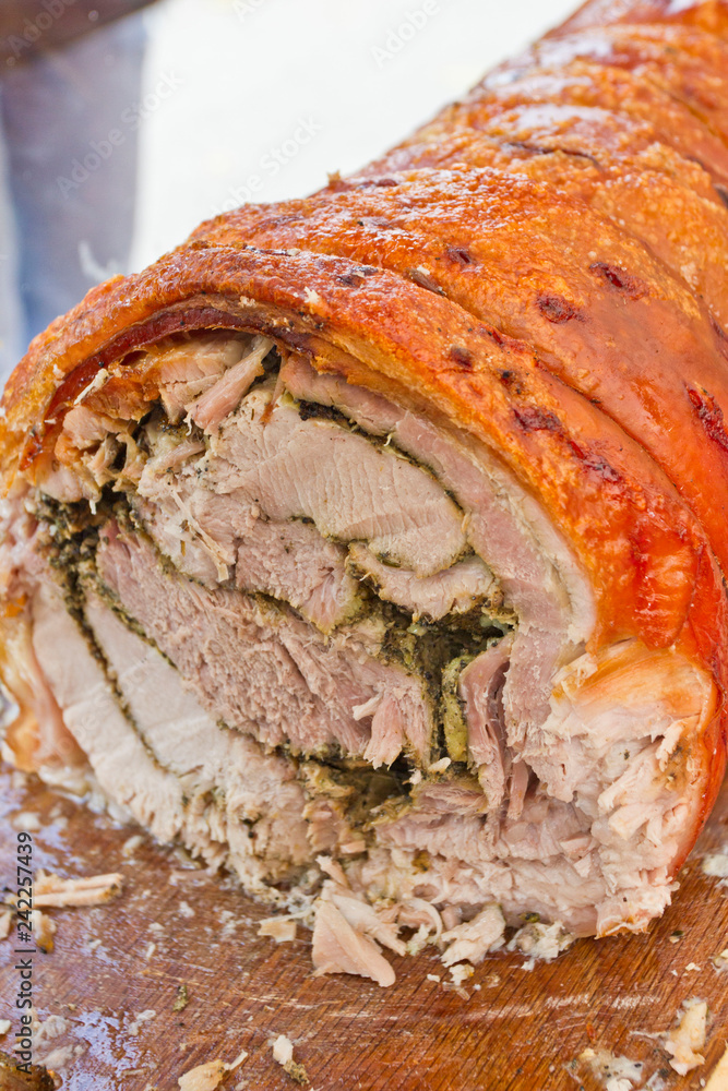 Fototapeta premium Roasted pork roll. BBQ pork roll baked with spices. Gourmet meat roll. Meat loaf with herbs. Stuffed roasted meat.