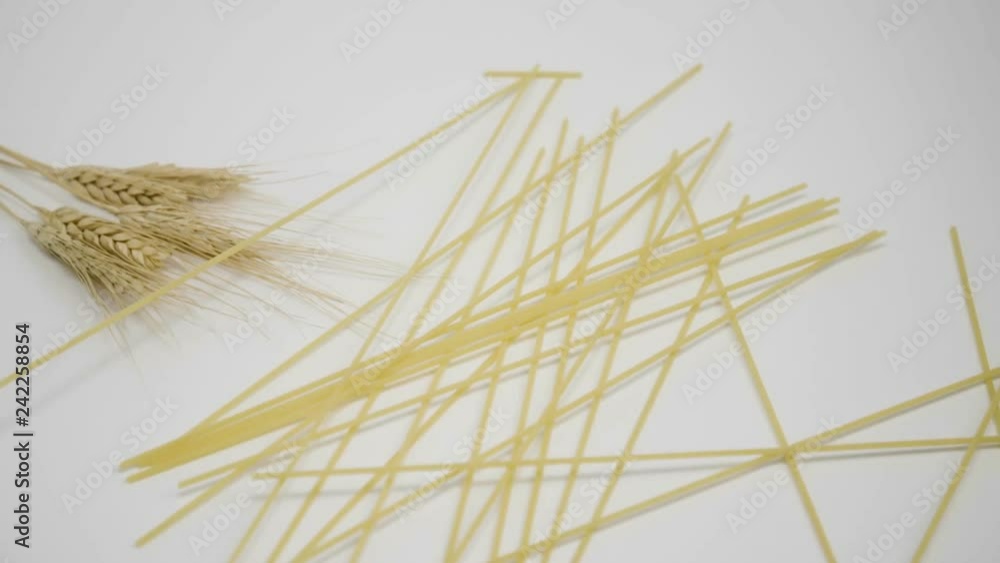 Spaghetti, noodles falling down on a wheat Spaghetti, noodles falling down on a wheat