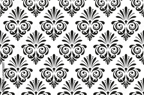 Floral pattern. Vintage wallpaper in the Baroque style. Seamless vector background. White and black ornament for fabric, wallpaper, packaging. Ornate Damask flower ornament