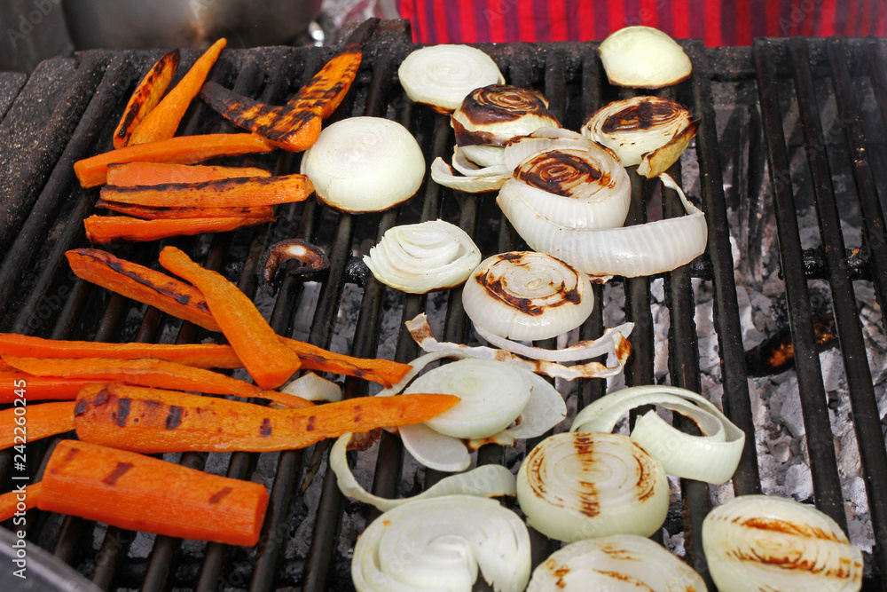Grilled onions, zucchini , carrots, corn.  Roasted vegetables on bbq. Baked vegetables background texture. Healthy food concept. 