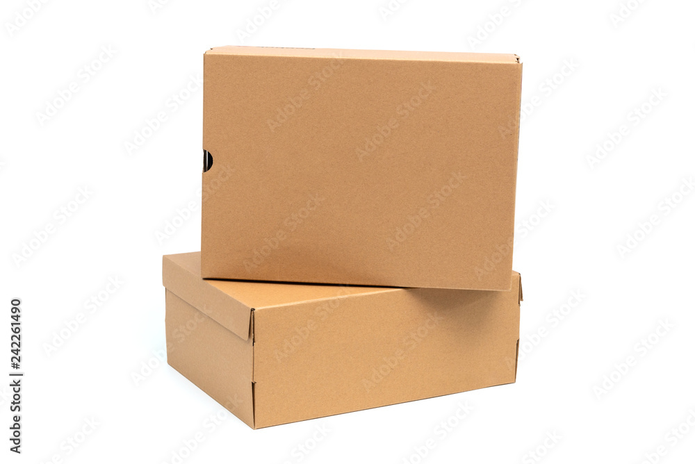 Brown cardboard shoes box with lid for shoe or sneaker product packaging mockup, isolated on white with clipping path. Brown cardboard shoes box with lid for shoe or sneaker product packaging mockup, isolated on white with clipping path.