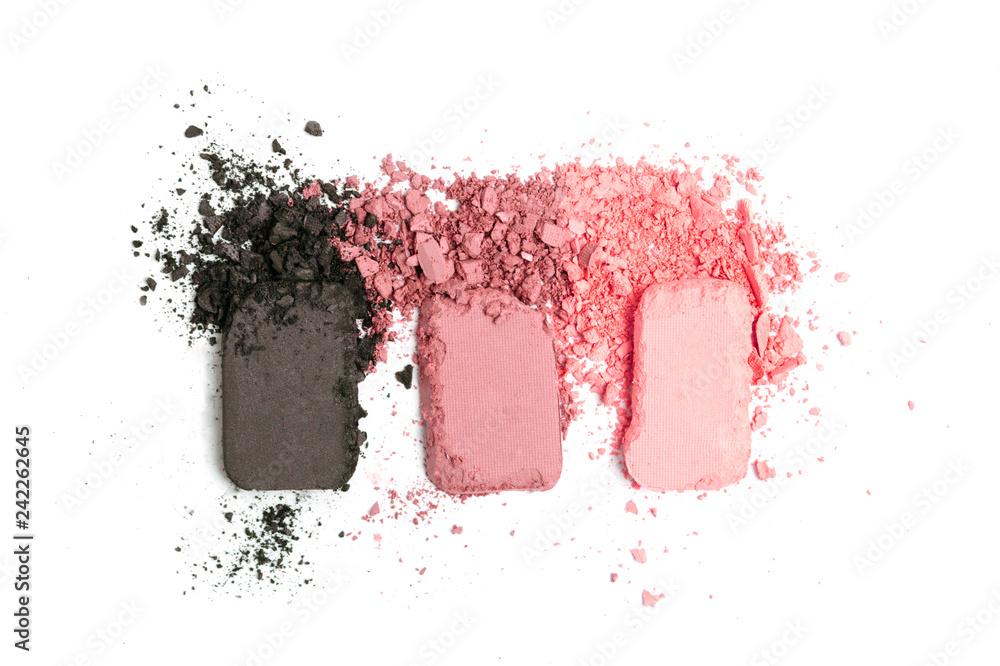 A broken pink gradient colored eye shadows isolated on a white background. Top view, flat lay. Copy space for your text