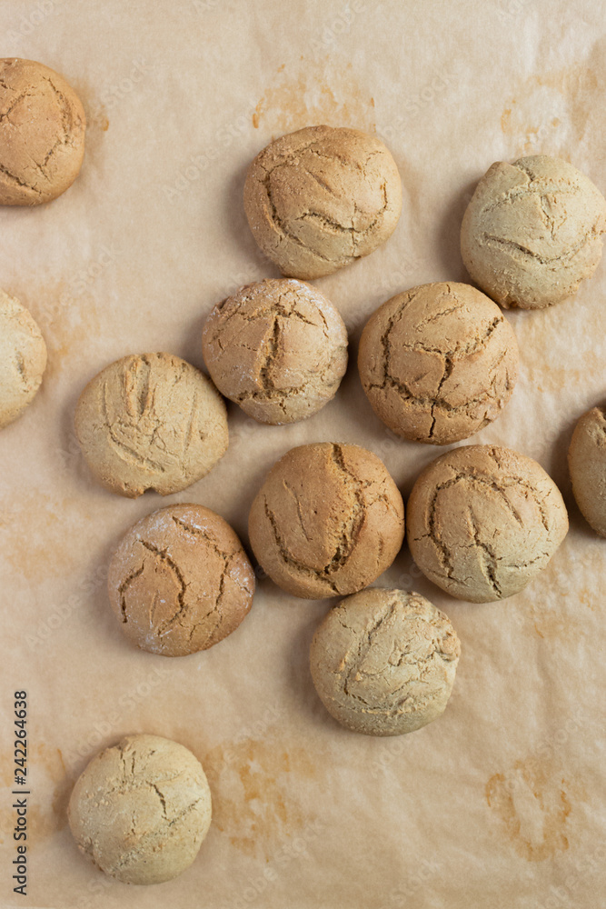 Homemade oatmeal cookies on kraft baking paper Homemade oatmeal cookies on kraft baking paper