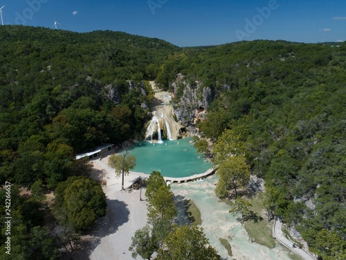 Fototapeta Naklejka Na Ścianę i Meble -  Aerial view of the breathtaking Turner Falls on a bright sunny day. Turner Falls is one of the two Oklahoma’s tallest waterfalls.  