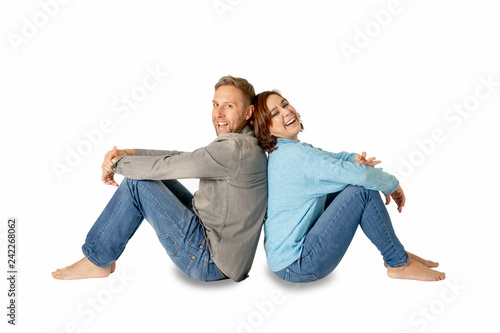 Young attractive smiling couple thinking of future or past together isolated on white and copy space