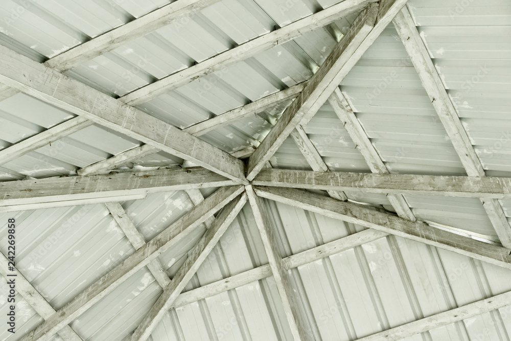 The dome of grey tin sheets and wooden beams The dome of grey tin sheets and wooden beams