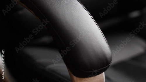 leather office chair handle close up