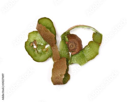 Peeled kiwi fruit skin isolated on white background