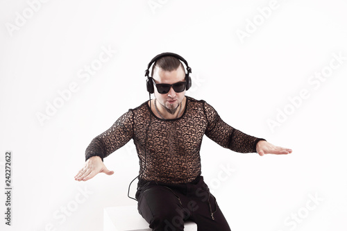 stylish modern guy with headphones listening to music.isolated on white