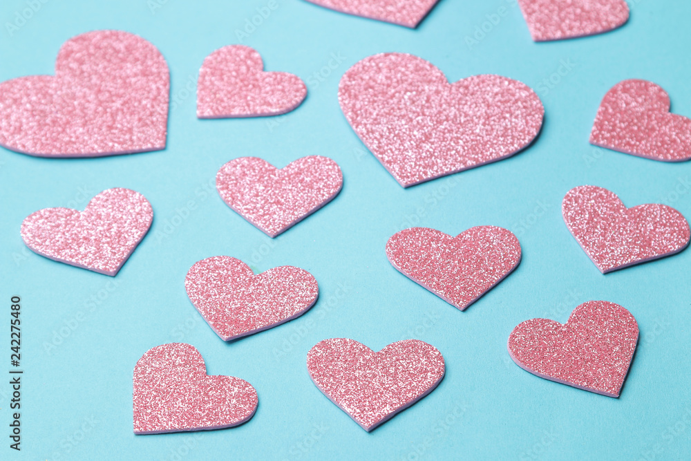 Pink hearts on a bright blue background. frame of hearts, with space for text Pink hearts on a bright blue background. frame of hearts, with space for text