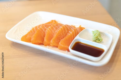 Salmon Slides with Wasabi in a Japanese Restaurant