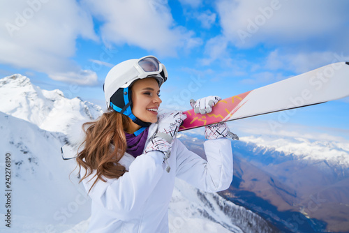 Happy Young Woman Skier Enjoying Sunny Weather In Alps Stock Photo