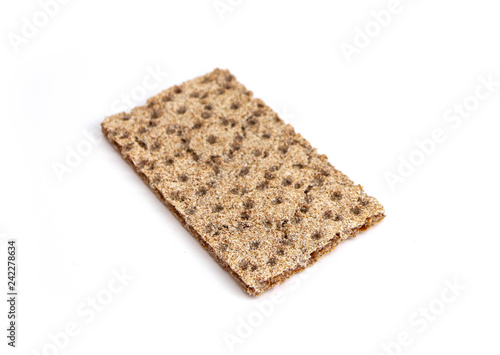 One crunchy wheat rye brown cracker, isolated on white background. Healthy food concept.