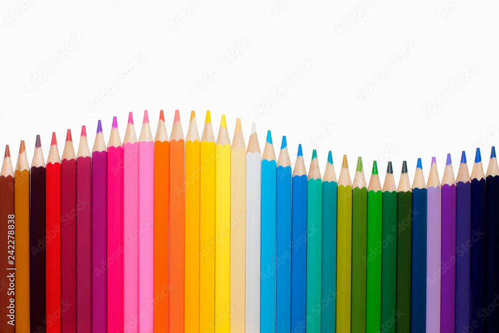 Wave of colorful wooden pencils isolated on white, panoramic background, back to school concept Wave of colorful wooden pencils isolated on white, panoramic background, back to school concept