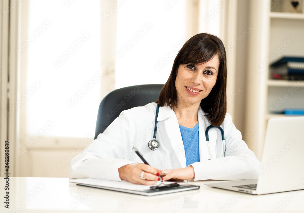 Female doctor working on medical expertise and searching information on laptop at hospital office Female doctor working on medical expertise and searching information on laptop at hospital office