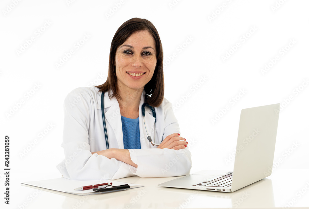 Female doctor working feeling up prescription and medical records using laptop isolated on white Female doctor working feeling up prescription and medical records using laptop isolated on white