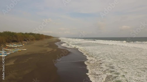 Wallpaper Mural aerial view sandy beach near ocean with big waves at sunset time in tropical resort, Yogyakarta, Indonesia. seascape, ocean and beautiful beach. Travel concept. Indonesia, java Torontodigital.ca