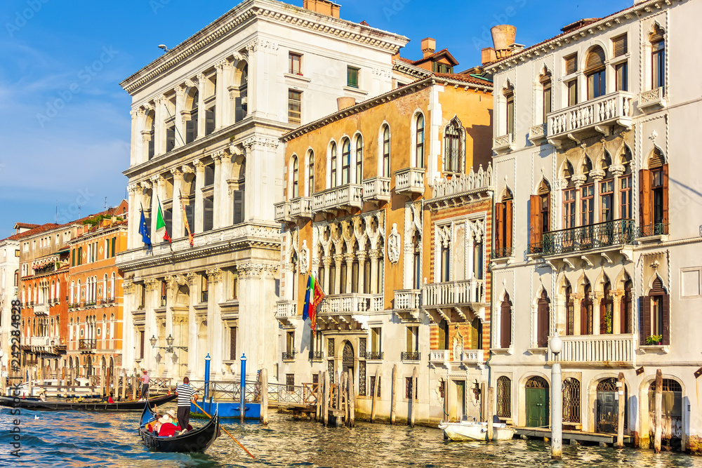 Naklejka premium Gondolier in Venice near old Venerian palaces of Grand Canal