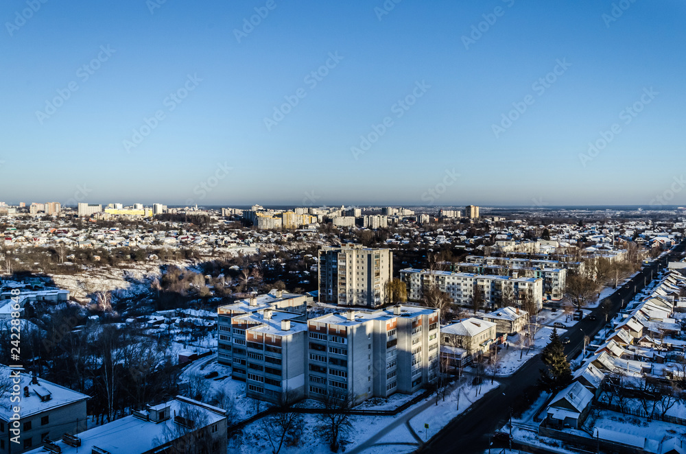 Fototapeta premium City in winter in Russia. The view from the height of winter in the city