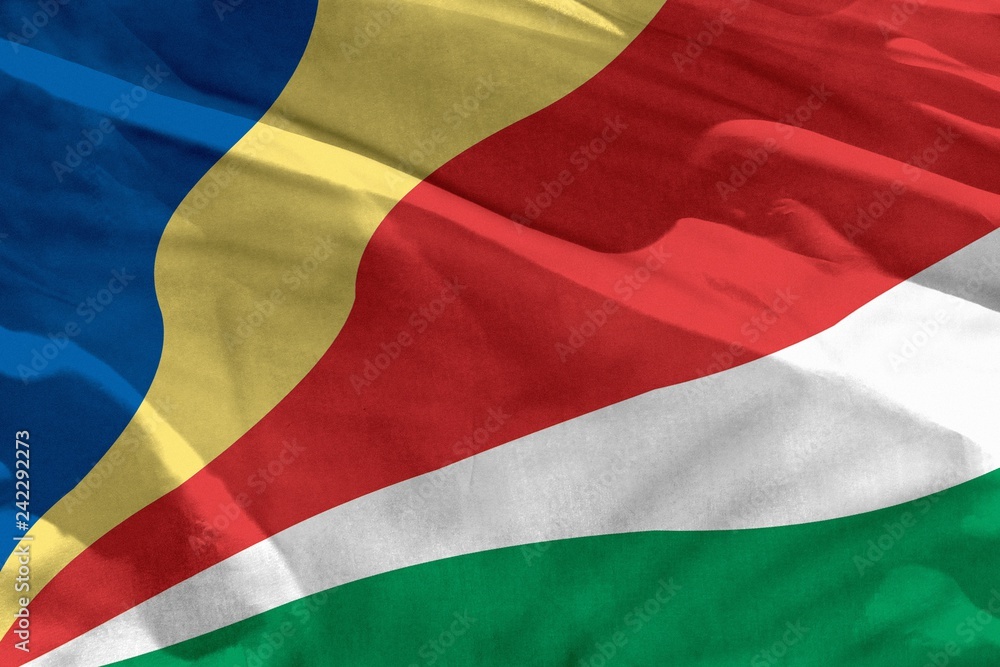 Obraz premium Waving Seychelles flag for using as texture or background, the flag is fluttering on the wind