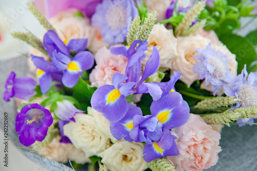 Fototapeta Naklejka Na Ścianę i Meble -  Purple irises and other flowers in the bouquet.