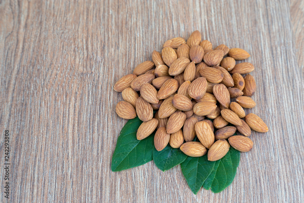 Almond nut on wood background. Almond nut on wood background.