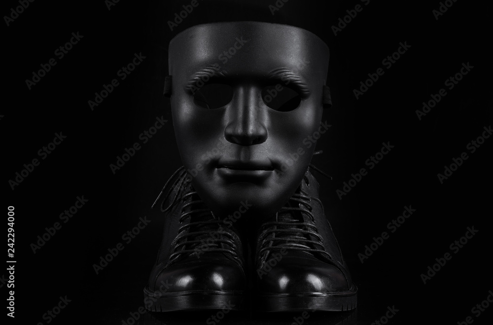 black men's shoes on a black isolated background black men's shoes on a black isolated background