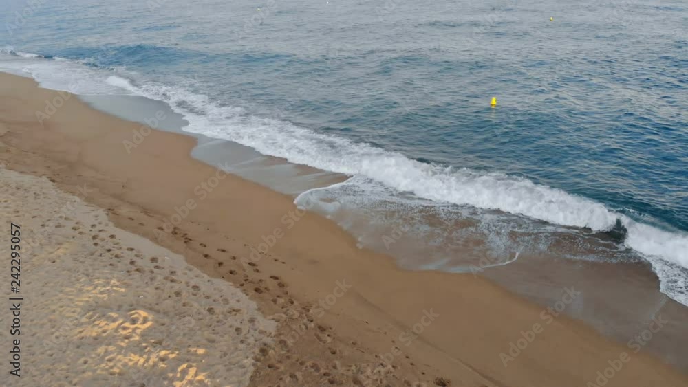View from above of a seashore with small waves View from above of a seashore with small waves