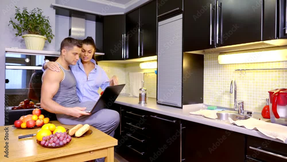 Man and woman choosing something online and discussing it. Man and woman choosing something online and discussing it.