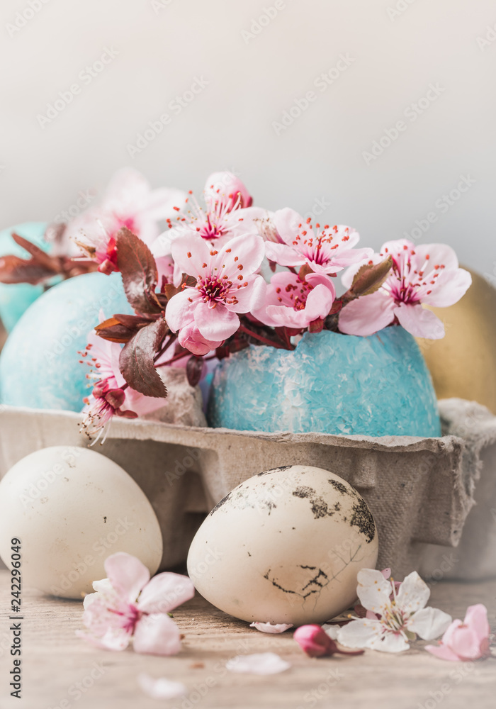 Easter eggs and spring flowers on rustic wooden background.Easter holiday card copy space. Easter eggs and spring flowers on rustic wooden background.Easter holiday card copy space.