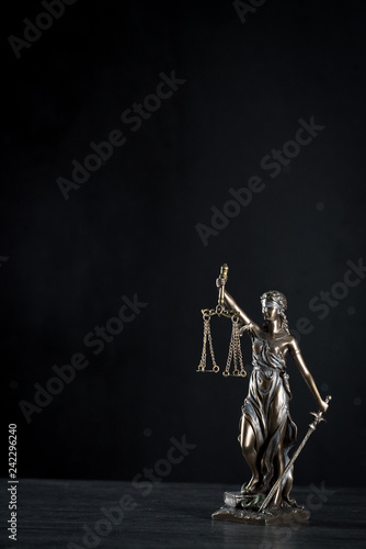  Goddess of justice on a beautiful black background. the subject of law