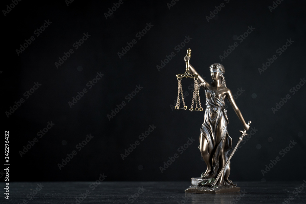 Goddess of justice on a beautiful black background. the subject of law Goddess of justice on a beautiful black background. the subject of law