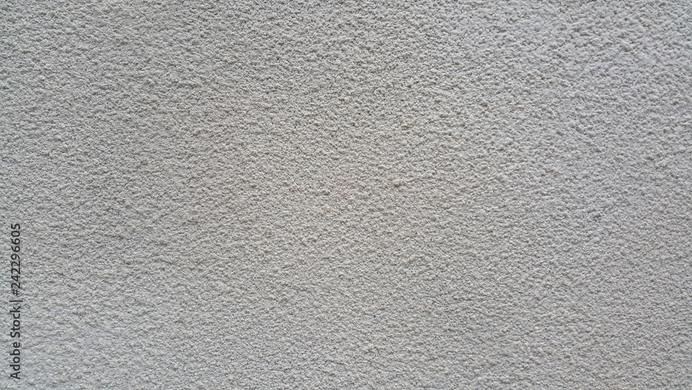 The texture of the plastered surface of the wall is gray as a background The texture of the plastered surface of the wall is gray as a background