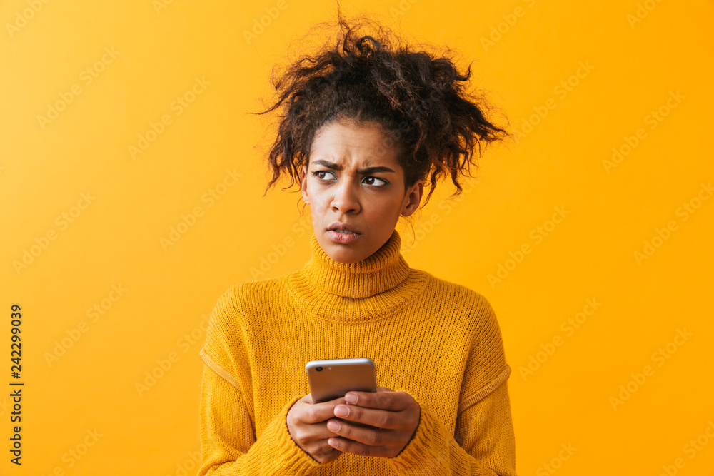Shocked confused african woman wearing sweater Shocked confused african woman wearing sweater