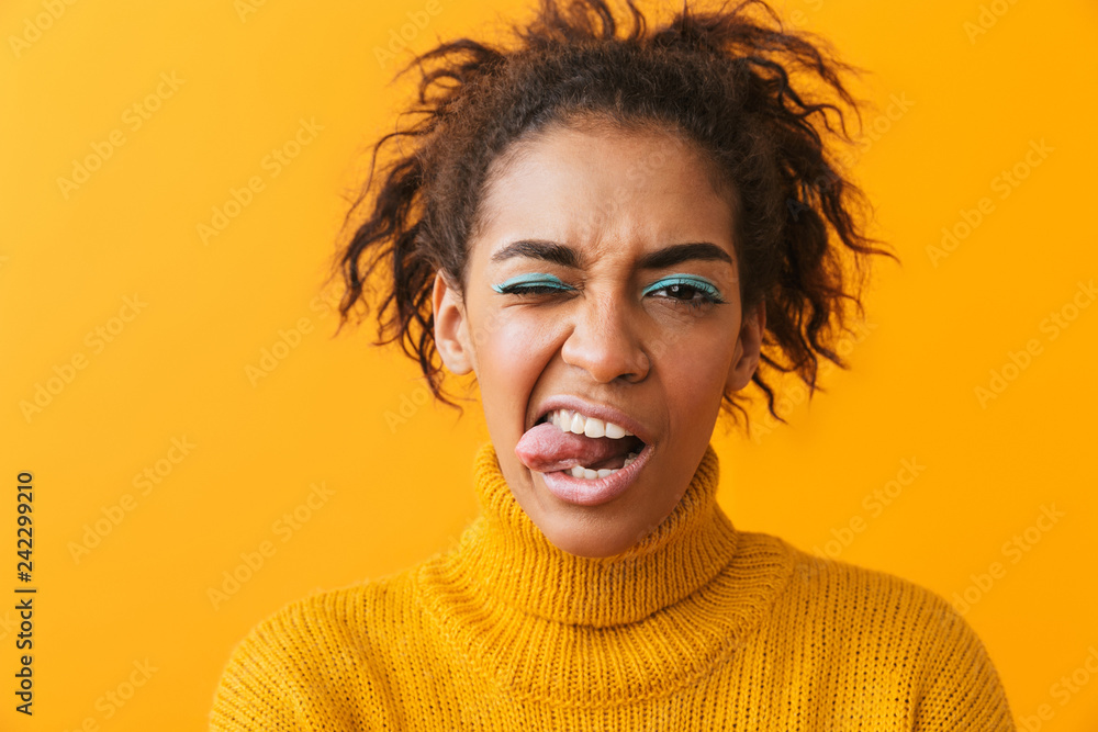 Cheerful young african woman wearing sweater Cheerful young african woman wearing sweater